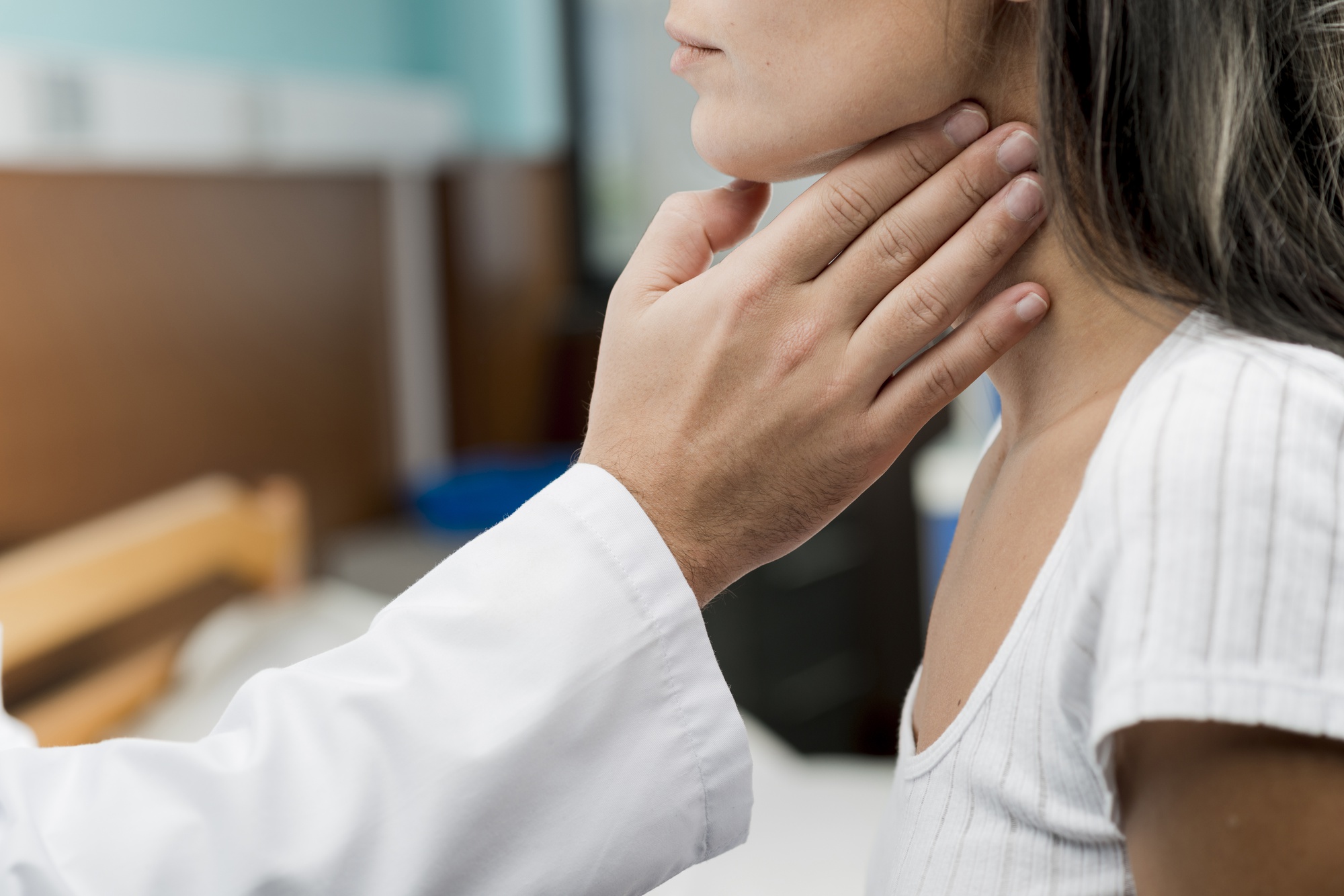 hand-touching-throat-patient
